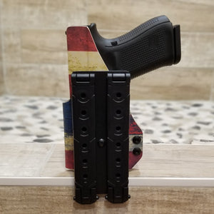 Outside Waistband Holster designed to fit a Glock 19, 23, 32, 19X or 45 with the Nightstick TCM-550XL or TCM-550XLS light mounted to the pistol. Adjustable retention High sweat shield and slide protection standard. Fit and function testing is done with the real Glock 19 with Nightstick TCM-550XLS light