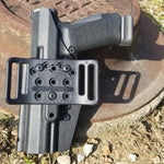 Outside Waistband Taco Style Holster designed to fit the Canik TP9 full size pistols. Holster is designed with adjustable retention High sweat shield and open muzzle design to allow threaded barrels and to allow dust, debri and that pesky last brass case to pass right on through.