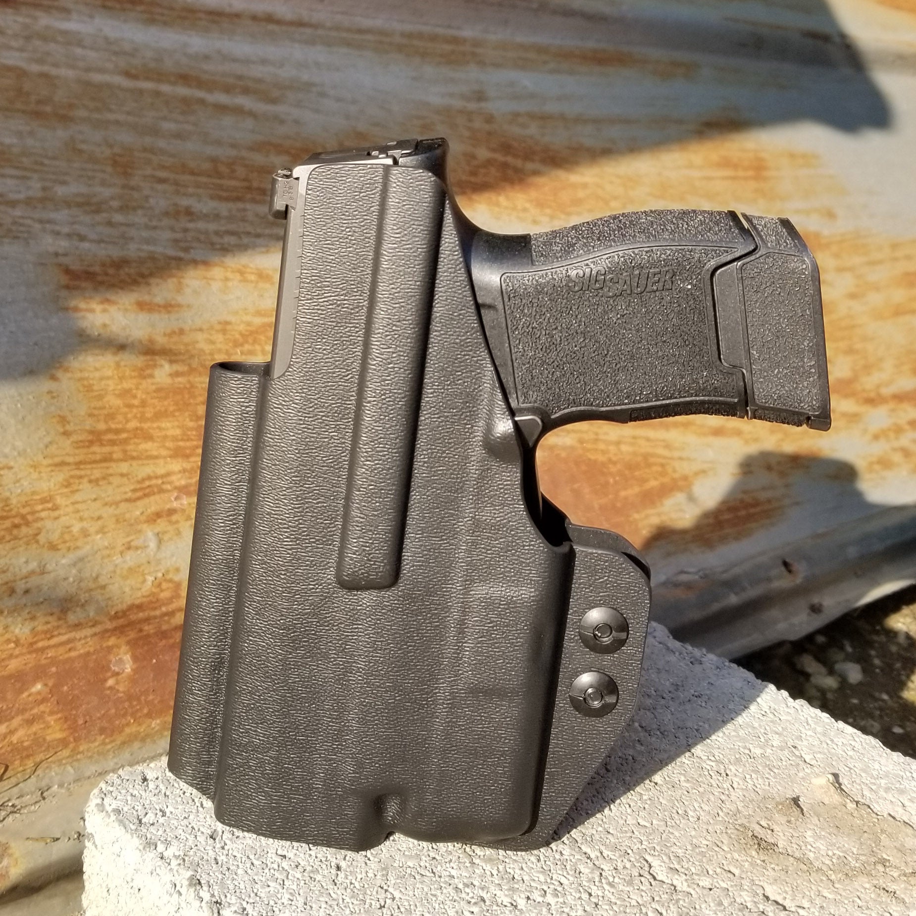 Inside Waistband Holster designed to fit the Sig P365 or P365X pistol with Streamlight TLR-6 light. Holster has adjustable retention,  high sweat shield standard. Profile of the holster cut to allow a red dot sight.  Open muzzle for threaded barrels.