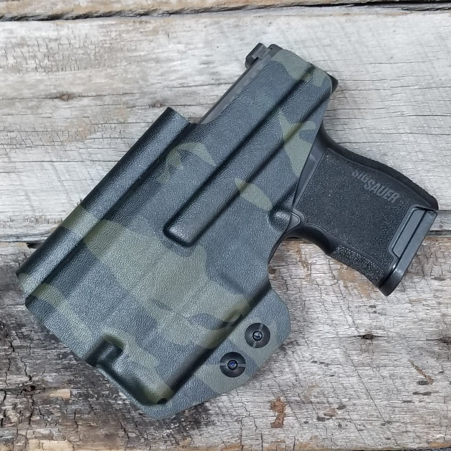 Inside Waistband Holster designed to fit the Sig P365 or P365X pistol with Streamlight TLR-6 light. Holster has adjustable retention,  high sweat shield standard. Profile of the holster cut to allow a red dot sight.  Open muzzle for threaded barrels.