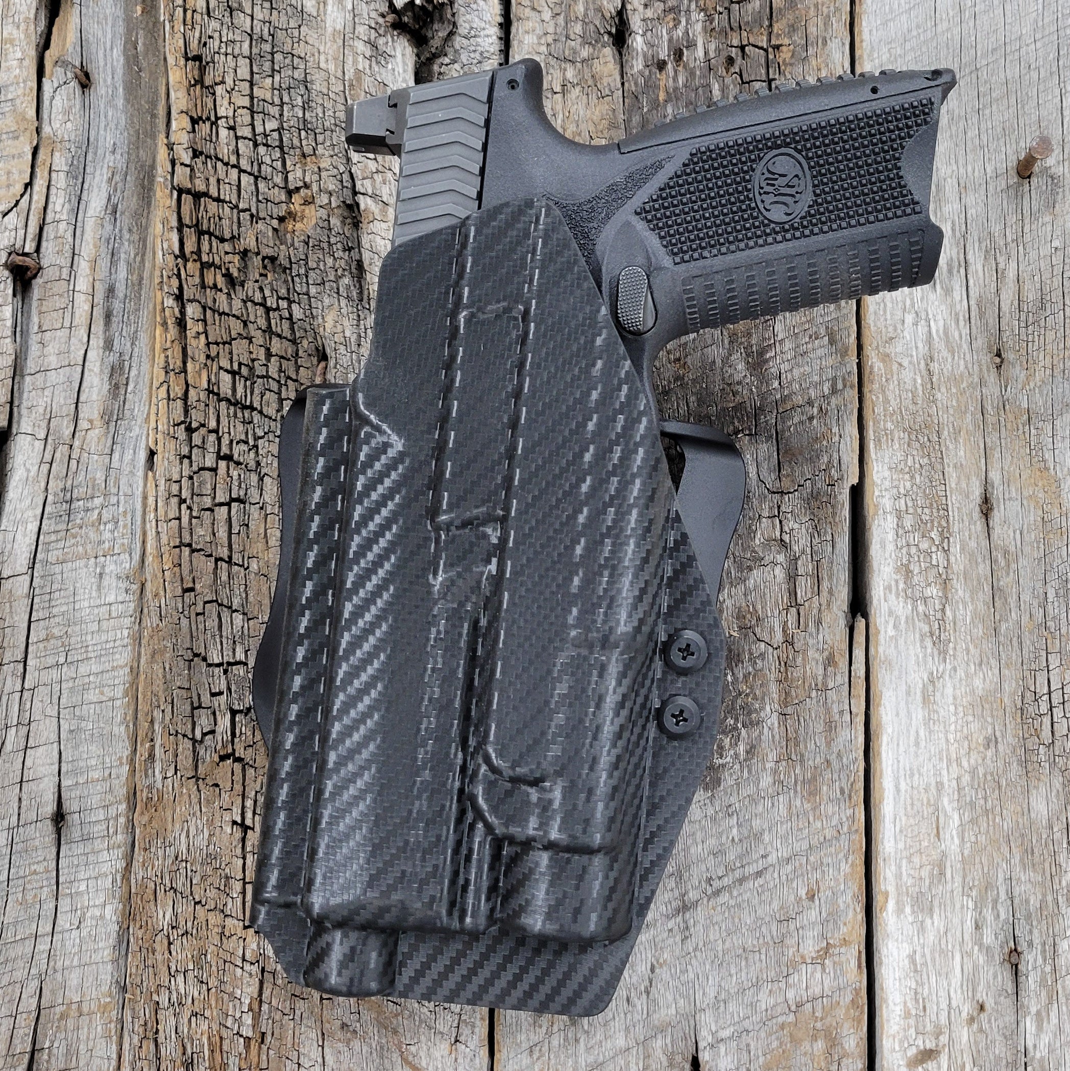 Left Hand Outside Waistband Taco Style Holster designed to fit the FN 509 LS Edge, 509 Full Size and 509 Tactical with Apex Tactical 5.00" Slide with the Streamlight TLR-1