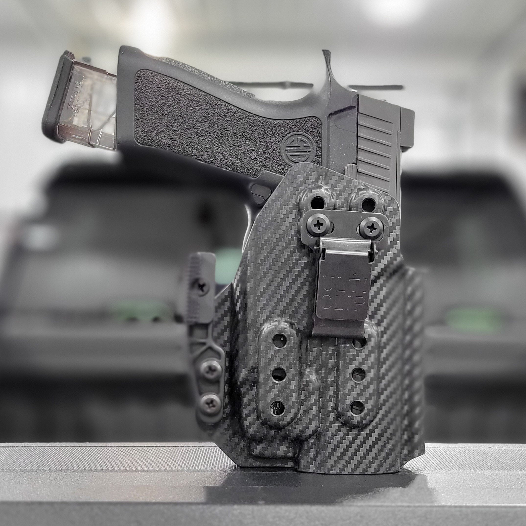 Inside Waistband Taco Style Holster for the Sig Sauer P320 Compact, Carry or M18 with TLR-8 or TLR-8A mounted to the pistol  Retention of the holster works directly with the light; the holster will not hold the pistol without the light mounted correctly.