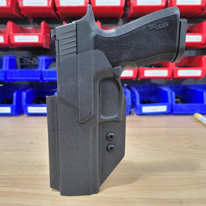 Our  Left Hand Outside Waistband holster for the Sig Sauer P320-XTEN pistol is vacuum formed with a precision machined mold designed from a CAD model of the actual firearm. Each holster is formed, trimmed and folded in house. Final fit and function tests are done with the actual pistol to ensure the holster fits the gun and has the correct amount of retention. The retention of the holster is easily adjusted so that the fit can be dialed in to your personal preference. 