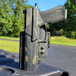 Inside Waistband IWB Kydex Taco Style Holster designed to fit the Sig Sauer 10MM . Full sweat guard, adjustable retention, open muzzle, and profiled for a red dot sight. Proudly made in the USA for veterans and law enforcement. 10 MM P320-XTEN, P320 X Ten or P 320 XTEN.
