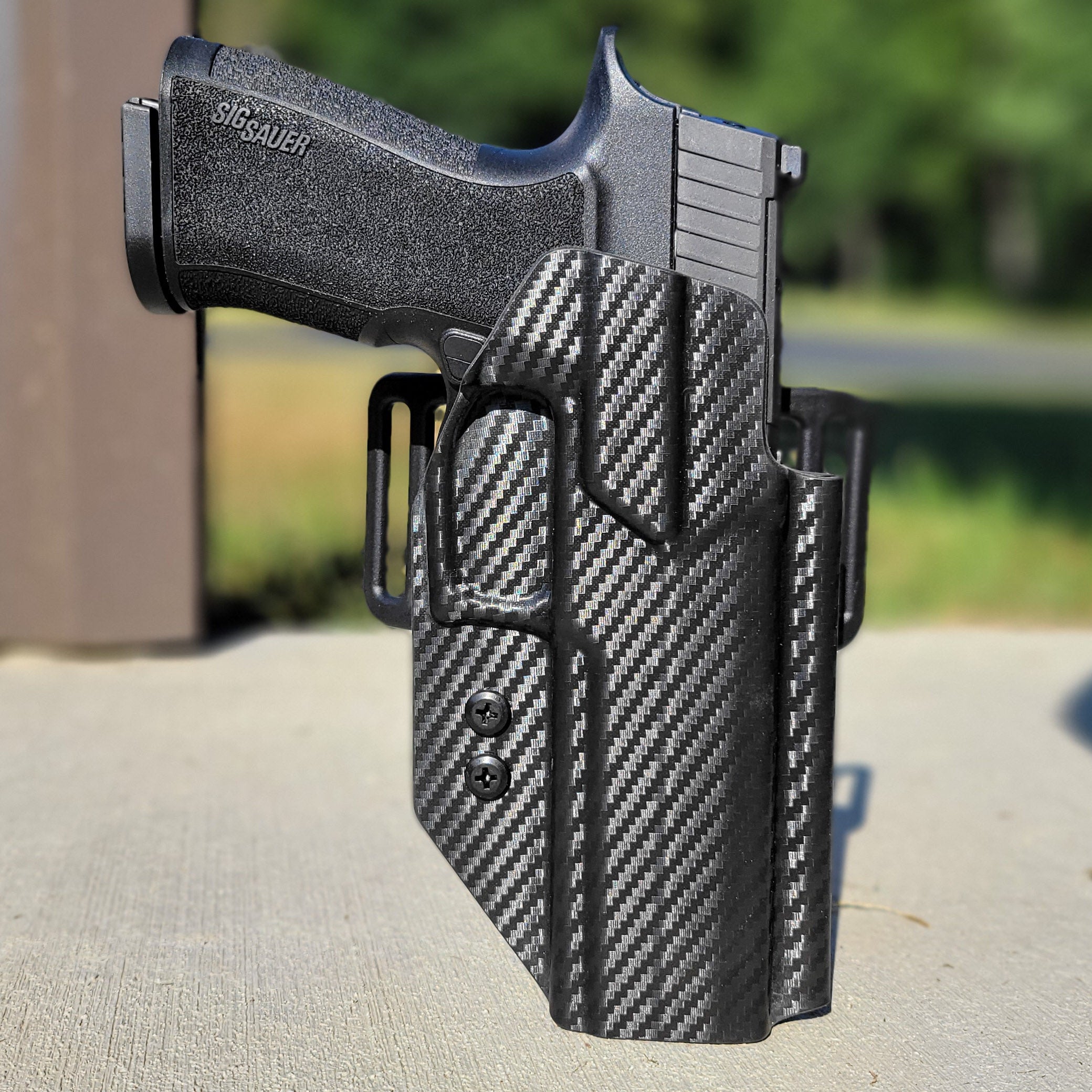 Outside Waistband OWB Kydex Taco Style Holster designed to fit the Sig Sauer 10MM . Full sweat guard, adjustable retention, open muzzle, and profiled for a red dot sight. Proudly made in the USA for veterans and law enforcement. 10 MM P320-XTEN, P320 X Ten or P 320 XTEN.