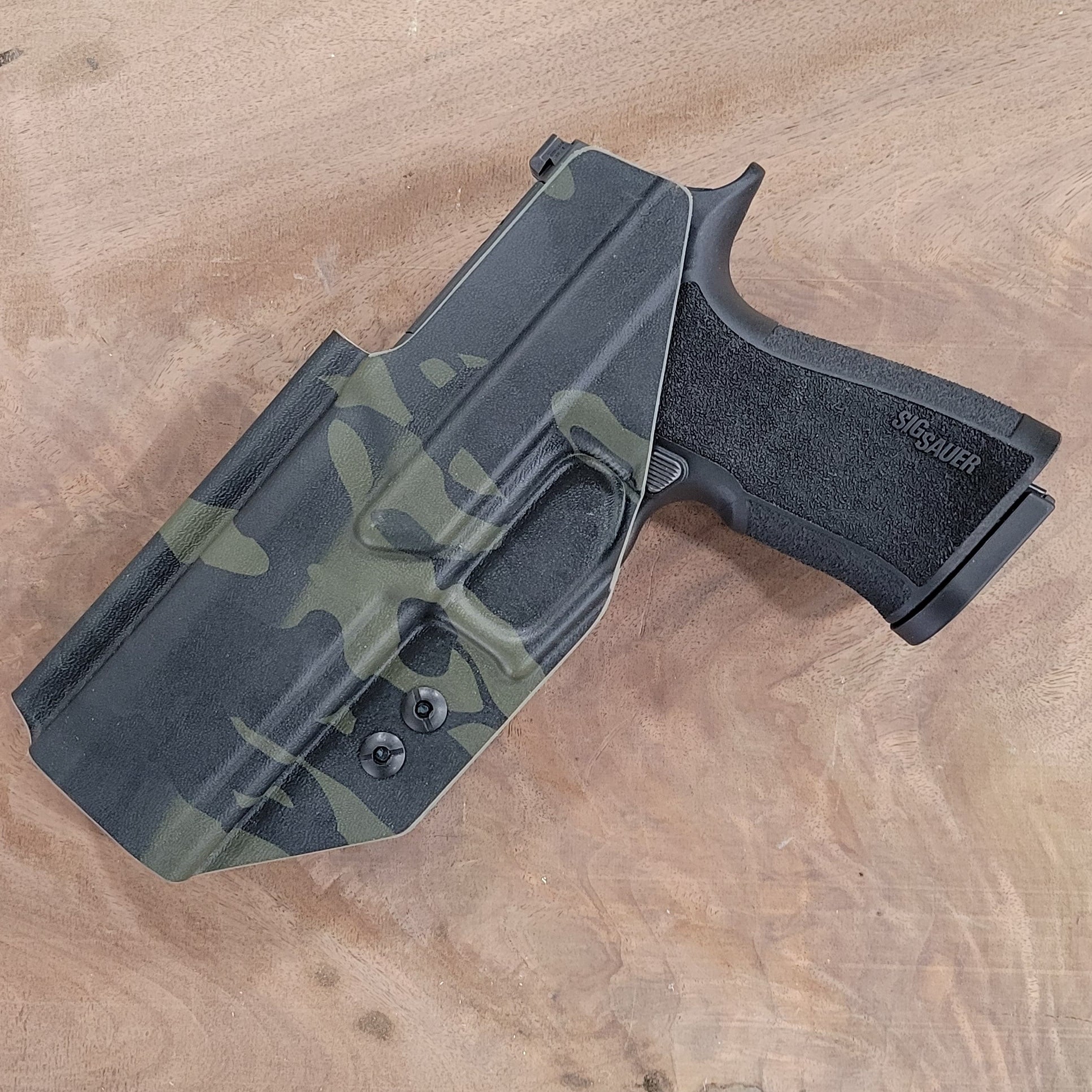 Inside Waistband IWB Kydex Taco Style Holster designed to fit the Sig Sauer 10MM . Full sweat guard, adjustable retention, open muzzle, and profiled for a red dot sight. Proudly made in the USA for veterans and law enforcement. 10 MM P320-XTEN, P320 X Ten or P 320 XTEN.