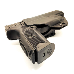 Outside Waistband Taco Style Kydex Holster for the FN 509 compact, 509, 509 Tactical, LS Edge, and Apex Tactical 5.00" slide with the Streamlight TLR-8 or TLR-8A. Open Muzzle, adjustable retention, cleared for suppressor height sights up to 3/8", full sweat guard, cut for red dot sights and optics. Made in the USA.
