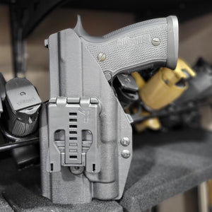 Outside Waistband Kydex Holster designed to fit the Full Size and Carry P320 series with Streamlight TLR-1 and TLR-1HL weapon mounted light and Align Tactical Thumb Rest Takedown Lever. The holster will accommodate the M17, M18, Carry, Compact, & X-Five models. Adjustable Retention, Made in USA. P 320 TLR1 TLR 1