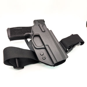Outside Waistband Duty & Competition Kydex holster designed to fit the Sig Sauer P322 Pistol with Blade-Tech Duty Drop and Offset Attachment and a Black 4Bros Thigh Strap.  Full sweat guard, adjustable retention, open muzzle, cleared for a red dot sight. Proudly made in the USA.  P 322 22 long rifle 22LR 22 LR Holster
