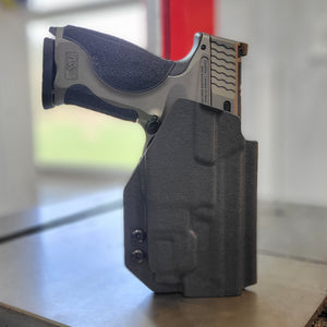 2023 Best Outside Waistband OWB Kydex Holster designed to fit the Smith & Wesson M&P M2.0 Metal pistols with the Streamlight TLR-7 or TLR-7A light mounted to the pistol. Full sweat guard, adjustable retention, minimal material, and smooth edges to reduce printing. Cleared for red dot sights. Proudly made in the USA.
