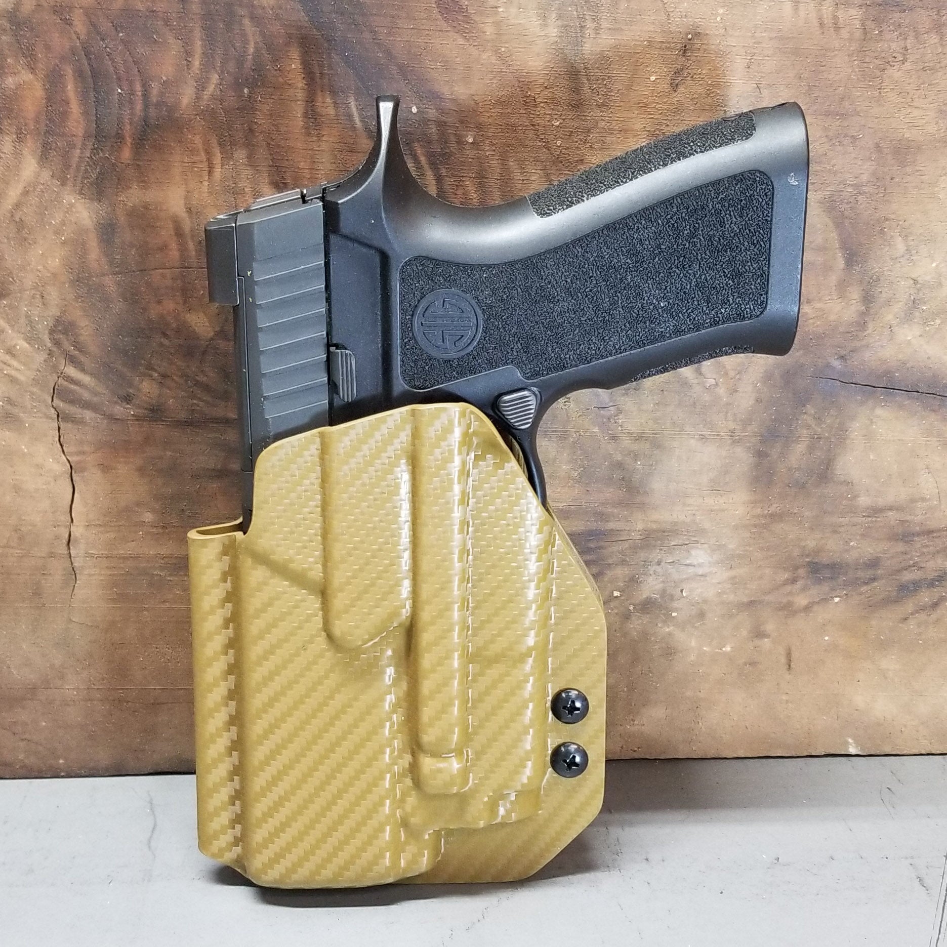 For the best Outside Waistband OWB Holster for the Sig Sauer Carry, Compact, and M18 P320 series pistols & Olight PL-Mini 2 shop Four Brothers 4BROS Holsters.