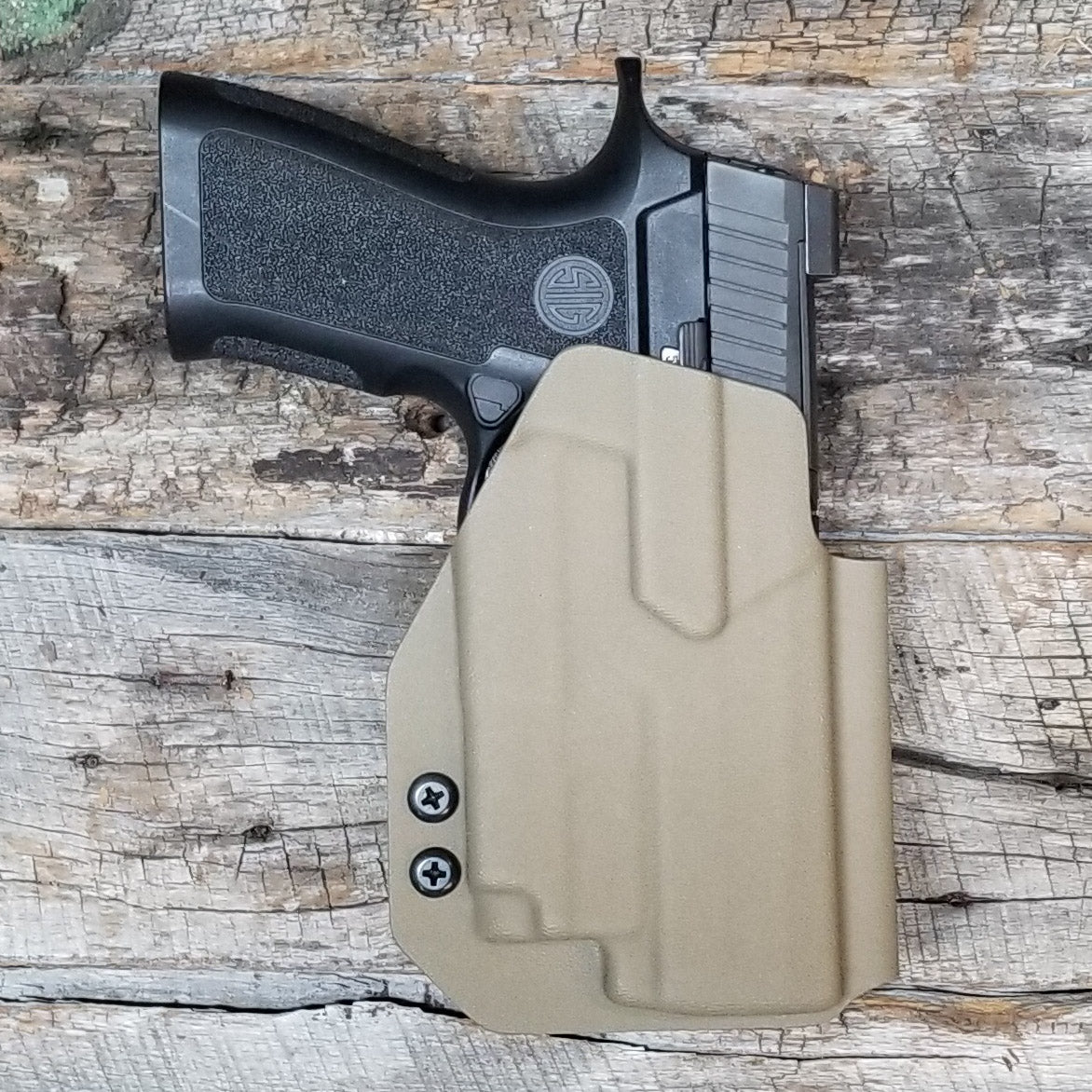 For the best Outside Waistband OWB Holster for the Sig Sauer Carry, Compact, and M18 P320 series pistols & Olight PL-Mini 2 shop Four Brothers 4BROS Holsters.