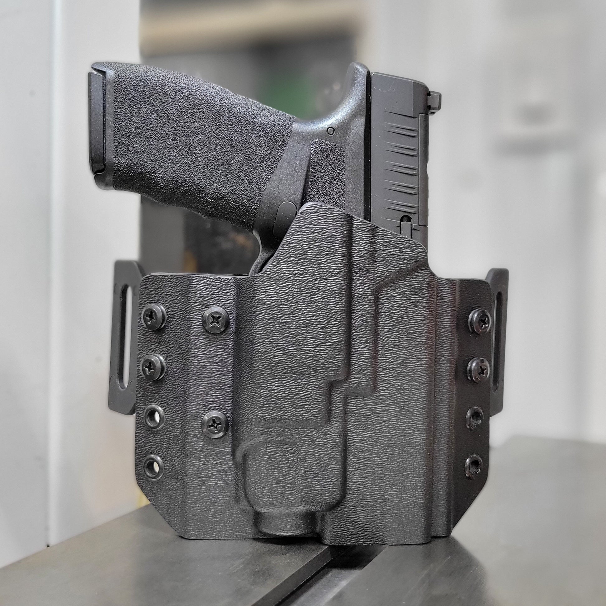 OWB Kydex holster for the Springfield Hellcat Pro with TLR-8 X & TLR-8 A. Pancake holster, adjustable retention, open muzzle, optic/red dot ready. Made in USA.