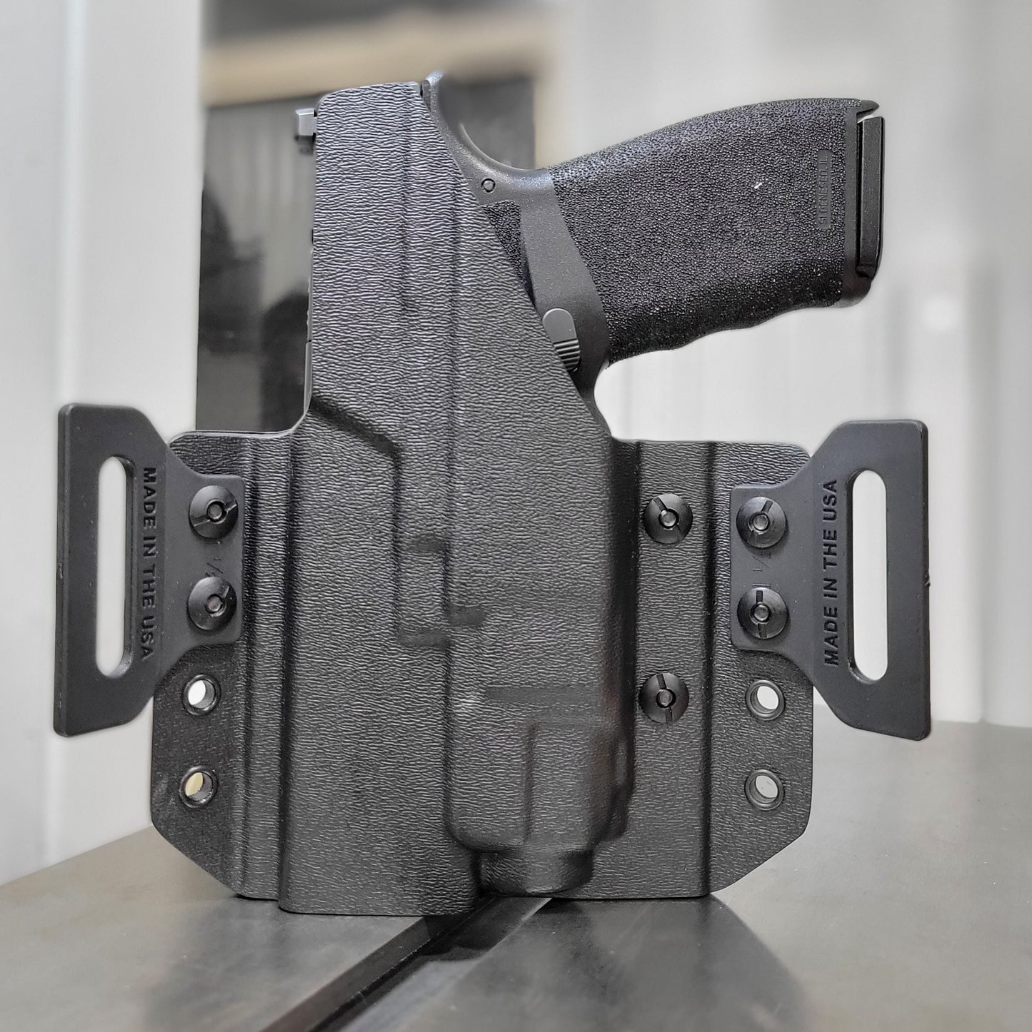 OWB Kydex holster for the Springfield Hellcat Pro with TLR-8 X & TLR-8 A. Pancake holster, adjustable retention, open muzzle, optic/red dot ready. Made in USA.